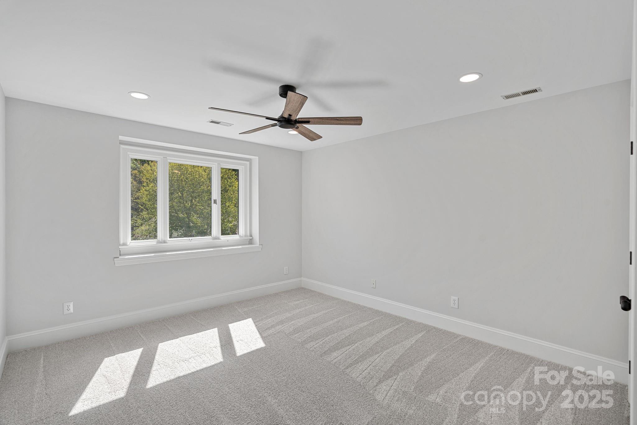17608 River Ford Drive Davidson, NC 28036 - Photo 29 of 48 a view of a livingroom with a ceiling fan and window