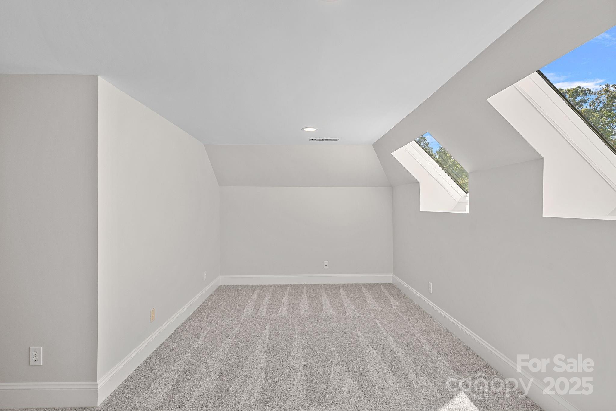 17608 River Ford Drive Davidson, NC 28036 - Photo 36 of 48 a view of an empty room with wooden floor and a window