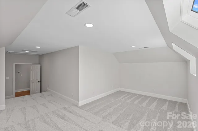 a living room with fireplace furniture and a large window