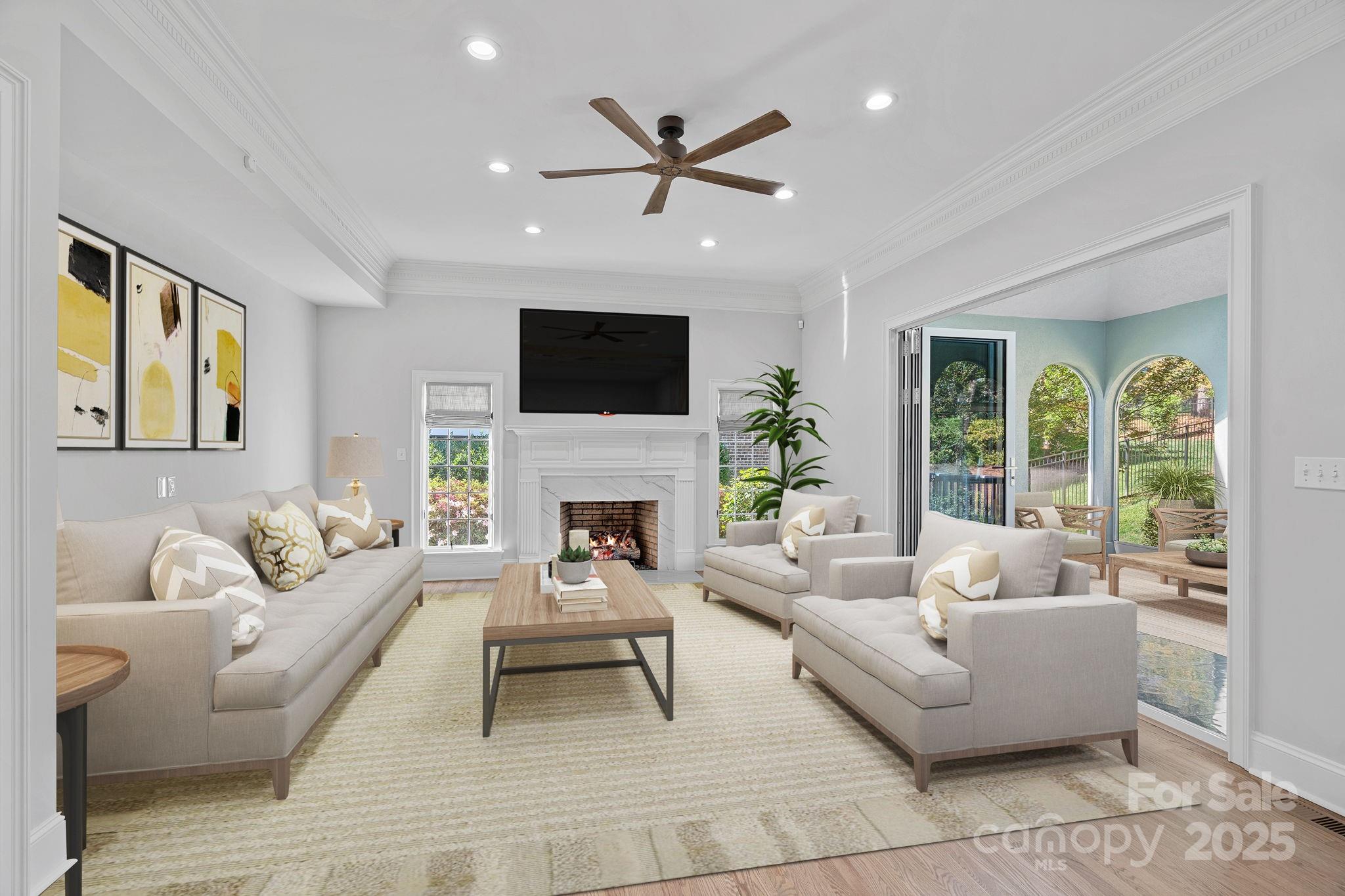 17608 River Ford Drive Davidson, NC 28036 - Photo 10 of 48 a living room with furniture a fireplace and a flat screen tv