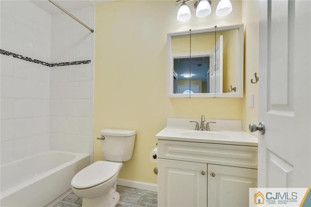 3 Valery Road Old Bridge, NJ 07747 - Photo 16 of 19 a bathroom with a sink toilet vanity and tub