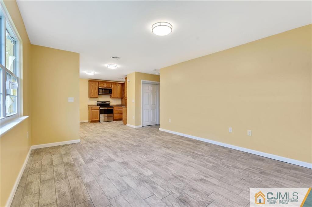 3 Valery Road Old Bridge, NJ 07747 - Photo 7 of 19 a view of livingroom with a flat screen tv
