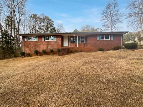 front view of a house with a yard