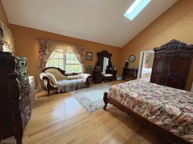 a bedroom with bed and window