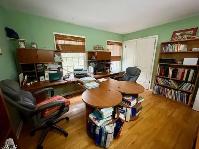 a living room with furniture and a bookshelf