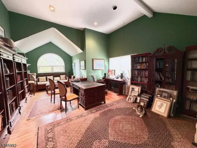 a living room with furniture a rug and a window