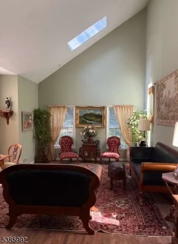 a living room with furniture lamp and rug