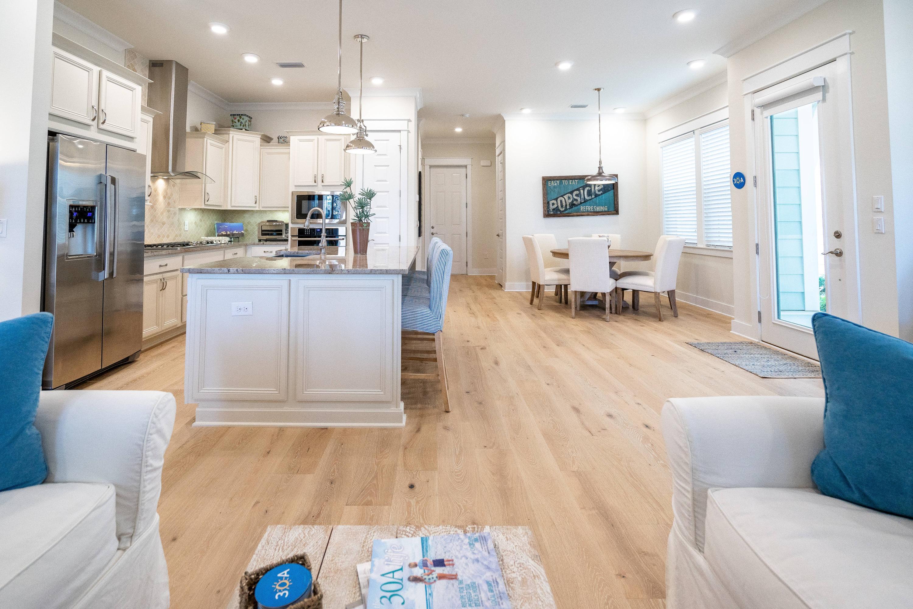 89 East Pine Lands Loop, Unit A Inlet Beach, FL 32461 - Photo 11 of 41 a living room with stainless steel appliances kitchen island granite countertop furniture and a kitchen view