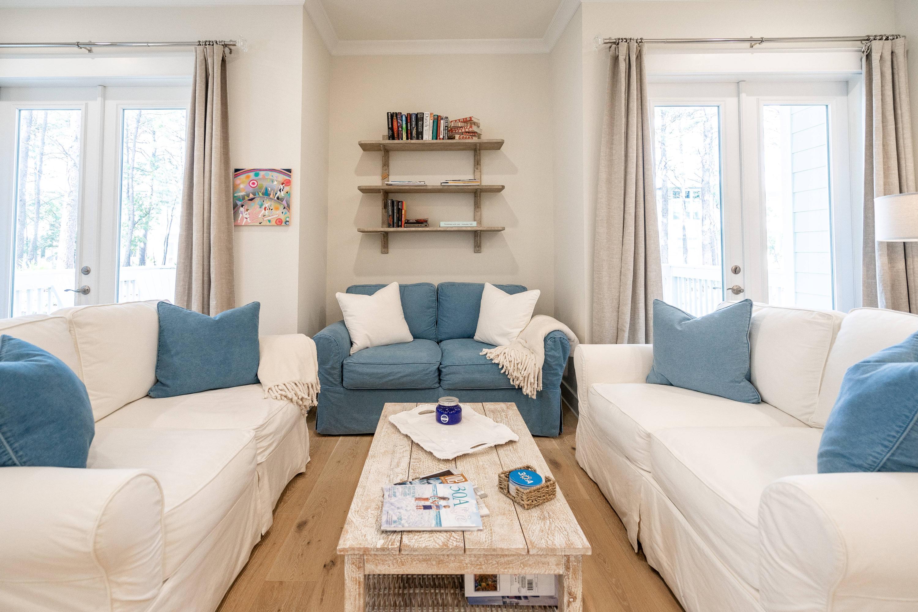 89 East Pine Lands Loop, Unit A Inlet Beach, FL 32461 - Photo 12 of 41 a living room with furniture and a window