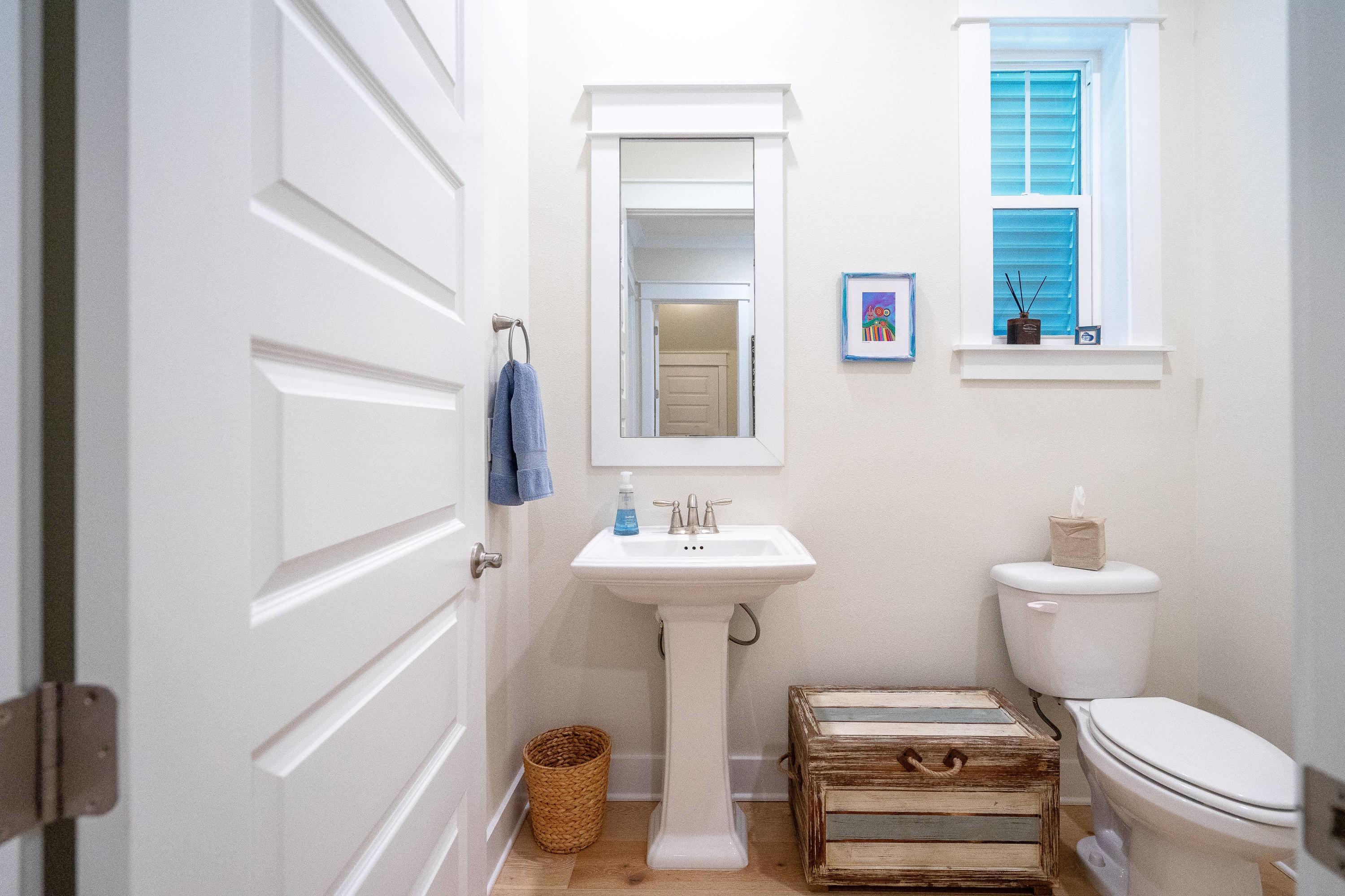 89 East Pine Lands Loop, Unit A Inlet Beach, FL 32461 - Photo 15 of 41 a bathroom with a sink toilet and mirror