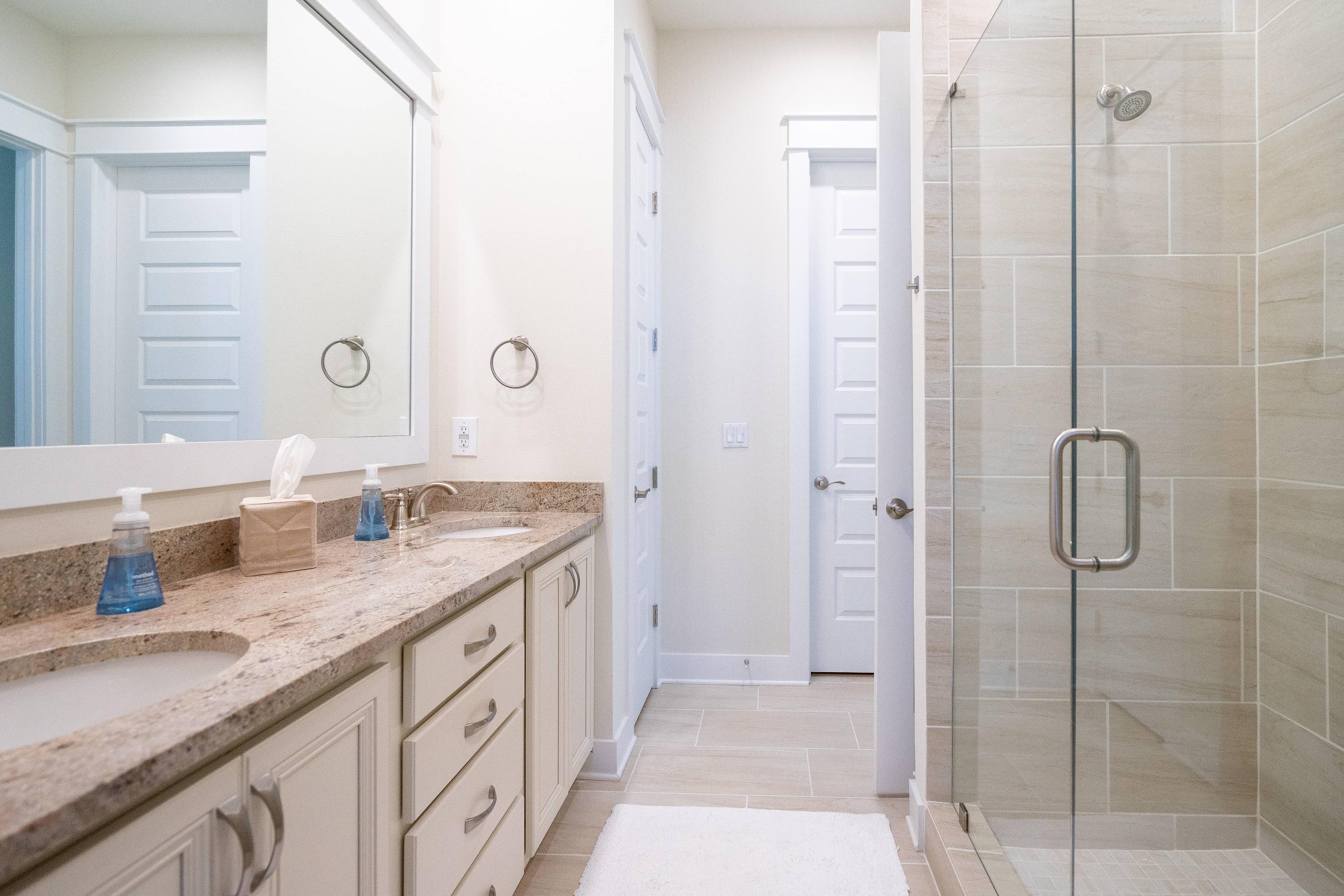 89 East Pine Lands Loop, Unit A Inlet Beach, FL 32461 - Photo 18 of 41 a bathroom with a granite countertop shower sink and mirror