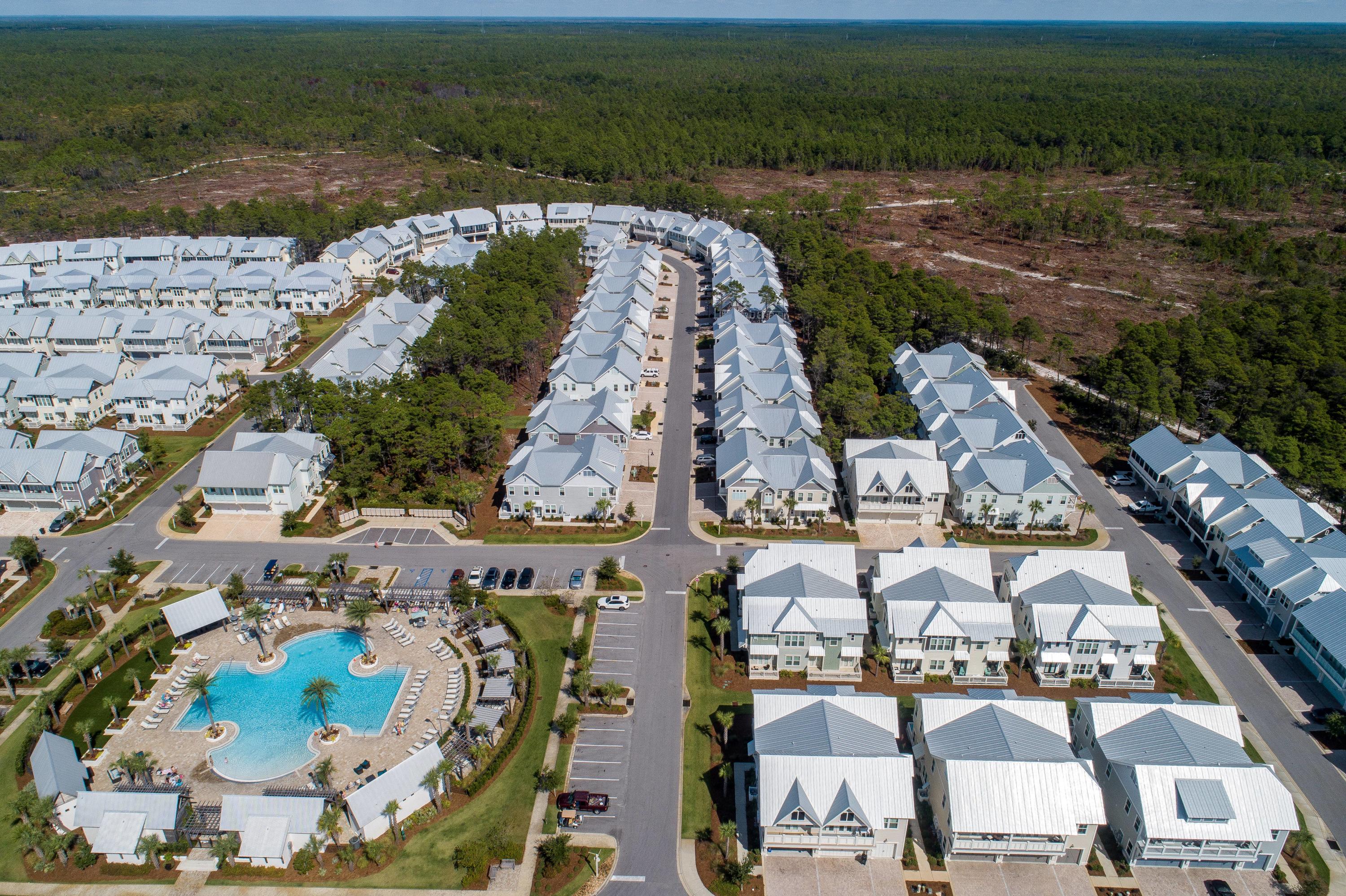 89 East Pine Lands Loop, Unit A Inlet Beach, FL 32461 - Photo 38 of 41 an aerial view of a house with a lake view