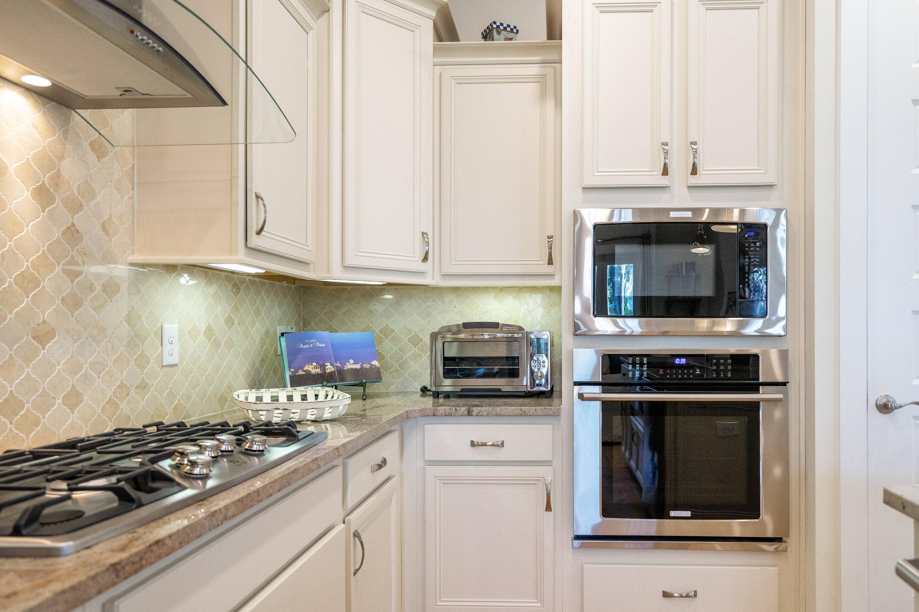 89 East Pine Lands Loop, Unit A Inlet Beach, FL 32461 - Photo 9 of 41 a kitchen with stainless steel appliances a stove and a microwave