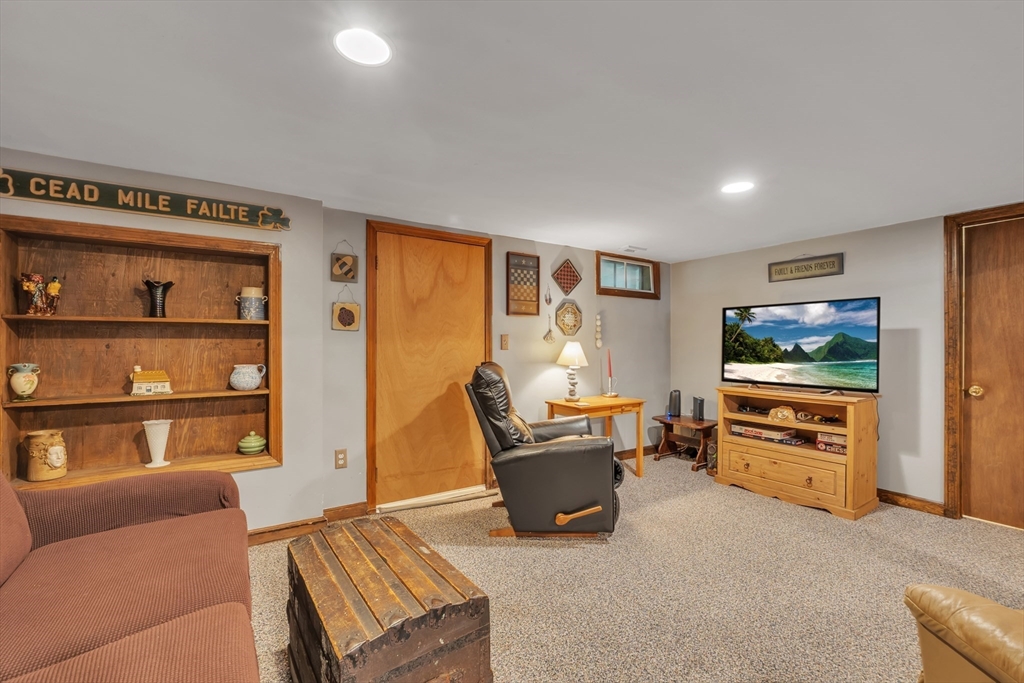 35 Laurelwood Road Rutland, MA 01543 - Photo 23 of 37 a living room with furniture and a flat screen tv