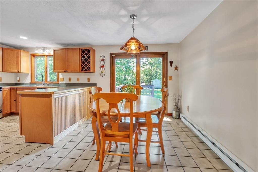 35 Laurelwood Road Rutland, MA 01543 - Photo 8 of 37 a dining room with furniture a chandelier and window