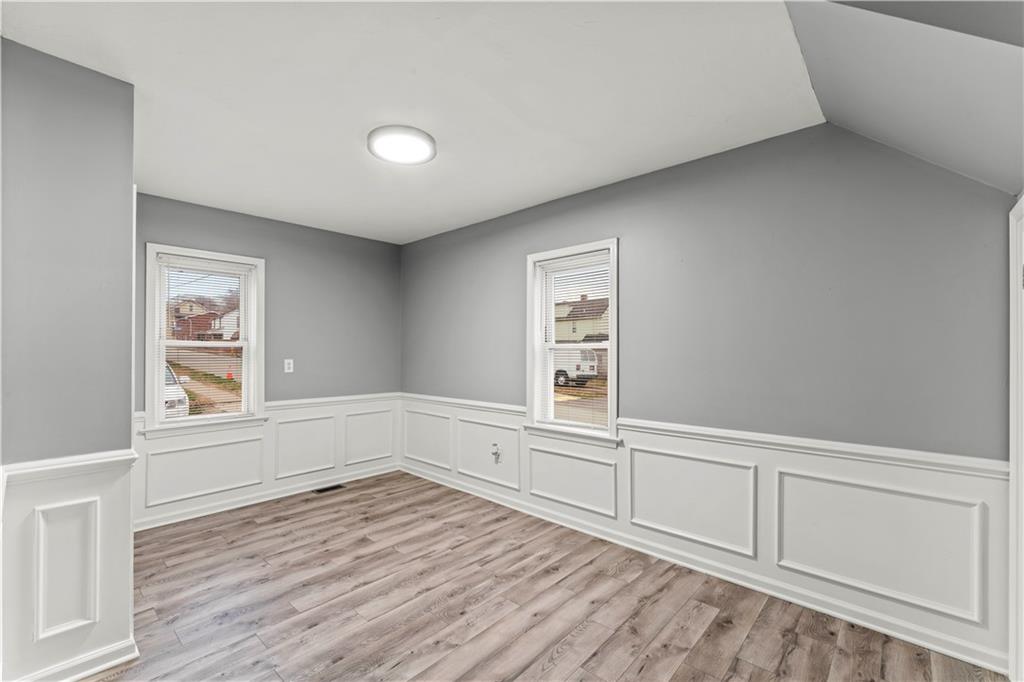 305 Perry Como Street Canonsburg, PA 15317 - Photo 19 of 33 wooden floor in an empty room with a window