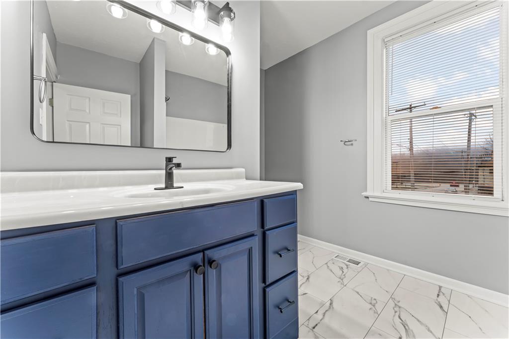 305 Perry Como Street Canonsburg, PA 15317 - Photo 20 of 24 a bathroom with a sink vanity and mirror