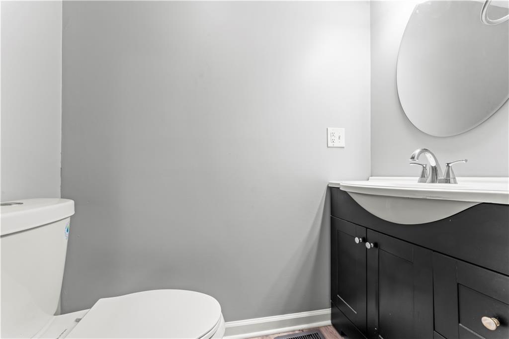 305 Perry Como Street Canonsburg, PA 15317 - Photo 20 of 33 a bathroom with a toilet a sink and mirror