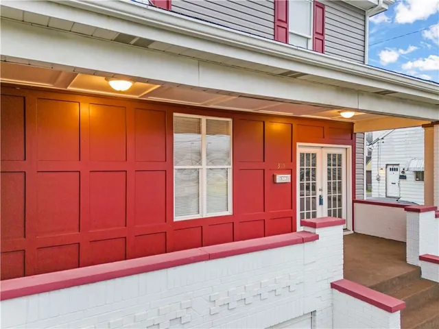 a view of an entryway with wooden floor