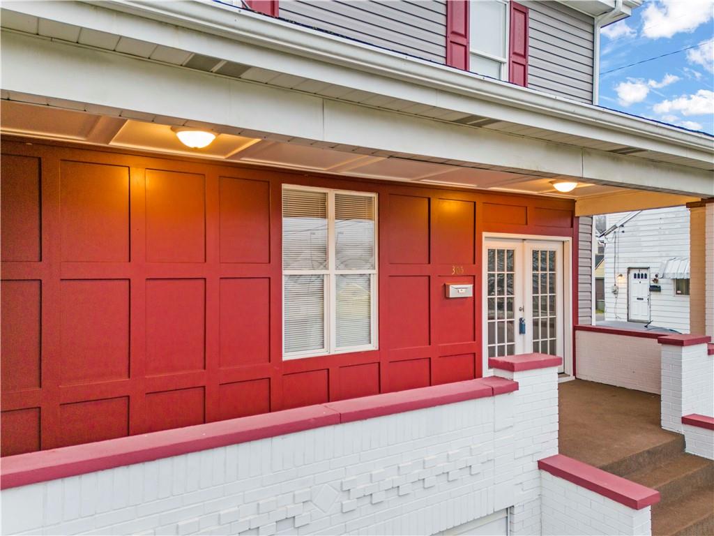 305 Perry Como Street Canonsburg, PA 15317 - Photo 4 of 24 a view of an empty room with wooden floor and furniture