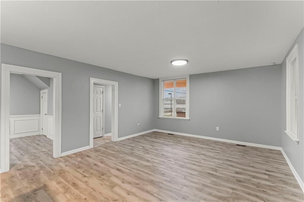 305 Perry Como Street Canonsburg, PA 15317 - Photo 7 of 24 a view of empty room with wooden floor and fan