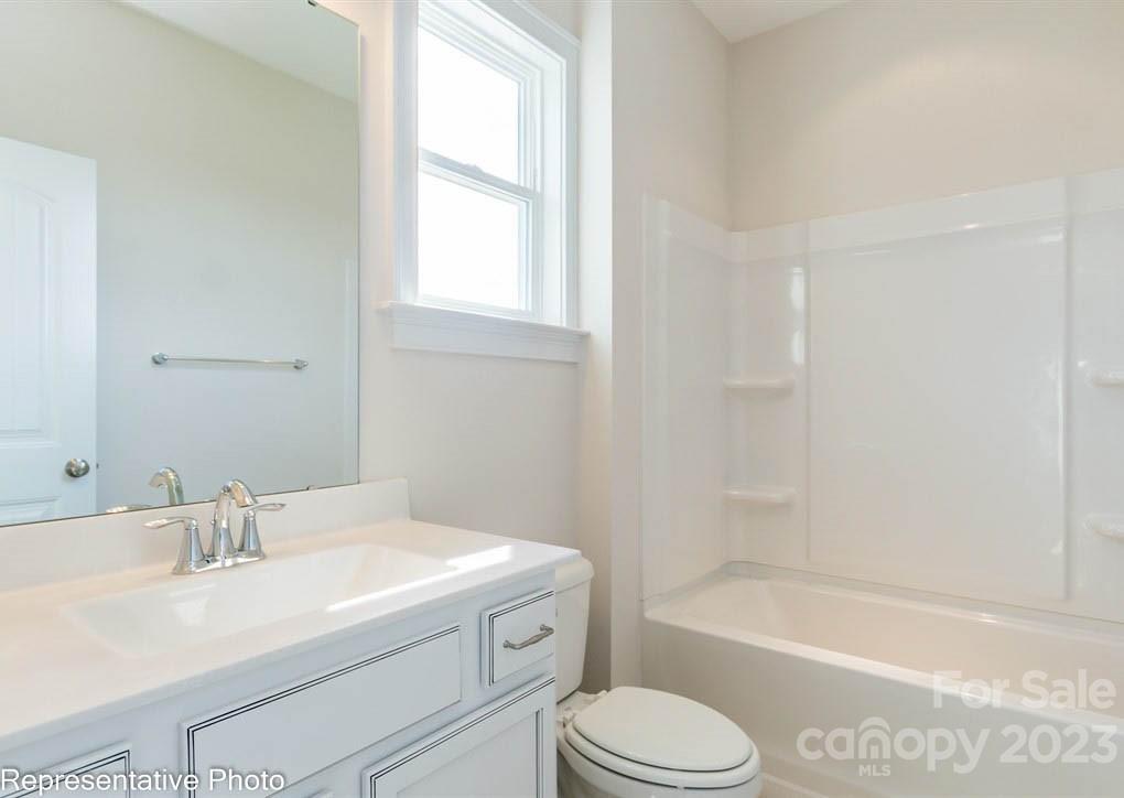 16327 Loch Raven Road Huntersville, NC 28078 - Photo 16 of 42 a bathroom with a sink toilet vanity and bathtub