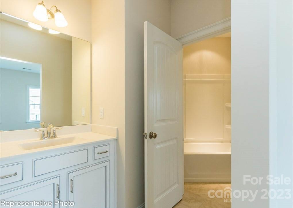 16327 Loch Raven Road Huntersville, NC 28078 - Photo 26 of 42 a bathroom with a sink and a mirror