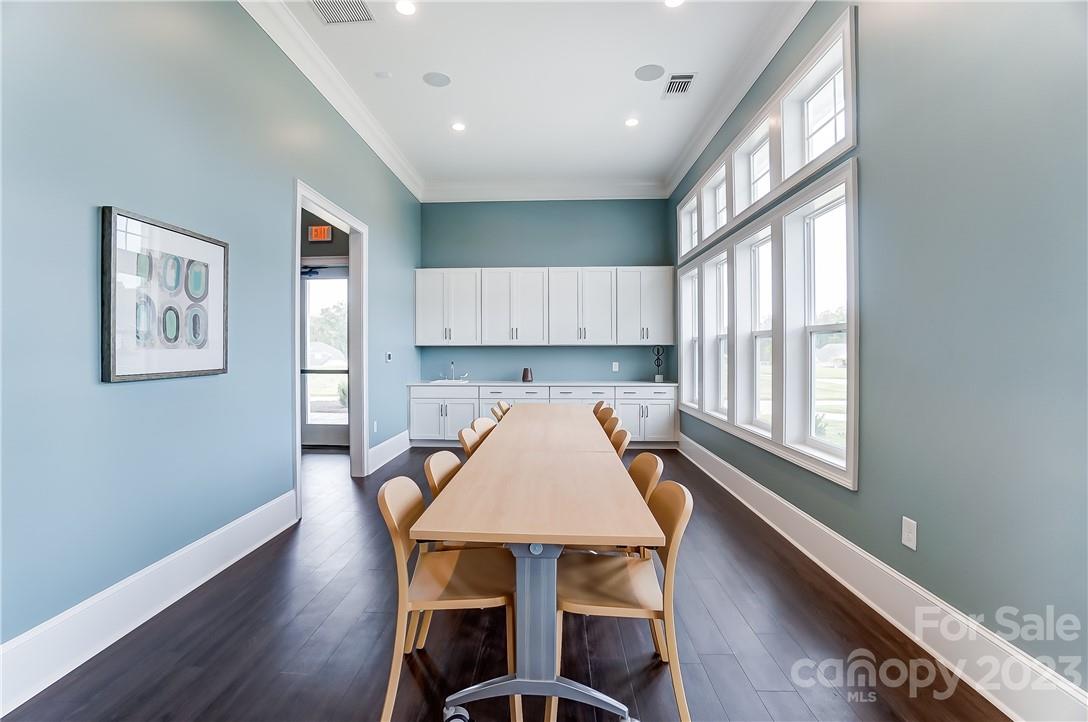 16327 Loch Raven Road Huntersville, NC 28078 - Photo 36 of 42 a kitchen with a table chairs refrigerator and window