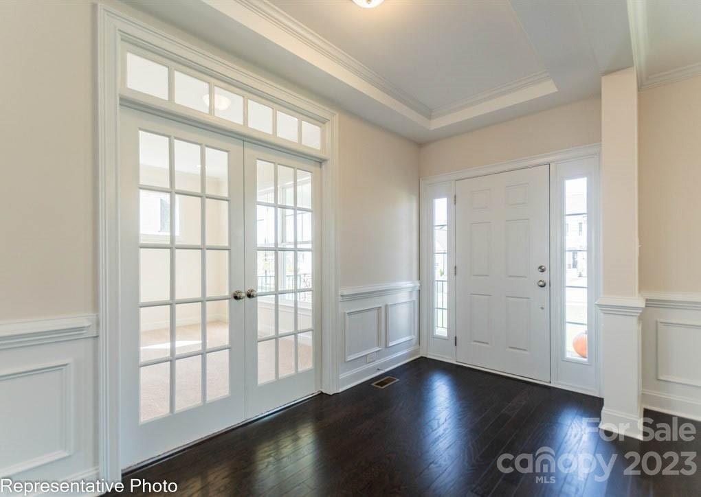 16327 Loch Raven Road Huntersville, NC 28078 - Photo 4 of 42 a view of an empty room with wooden floor and a window