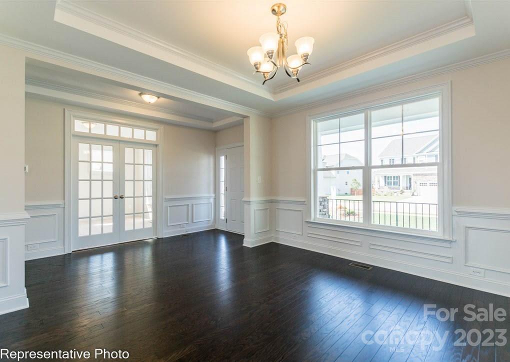16327 Loch Raven Road Huntersville, NC 28078 - Photo 5 of 42 a view of an empty room with wooden floor and a window