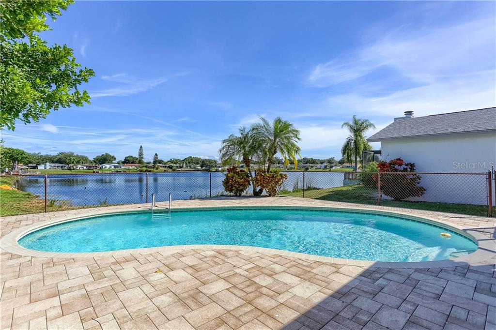 12481 84th Way Largo, FL 33773 - Photo 1 of 1 The marcite pool features a paver stone pool deck overlooking a 5 acre pond. You can take out a canoe or paddle boat right from your own back yard.