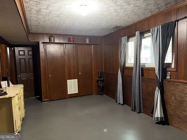 a view of a hallway with bathroom