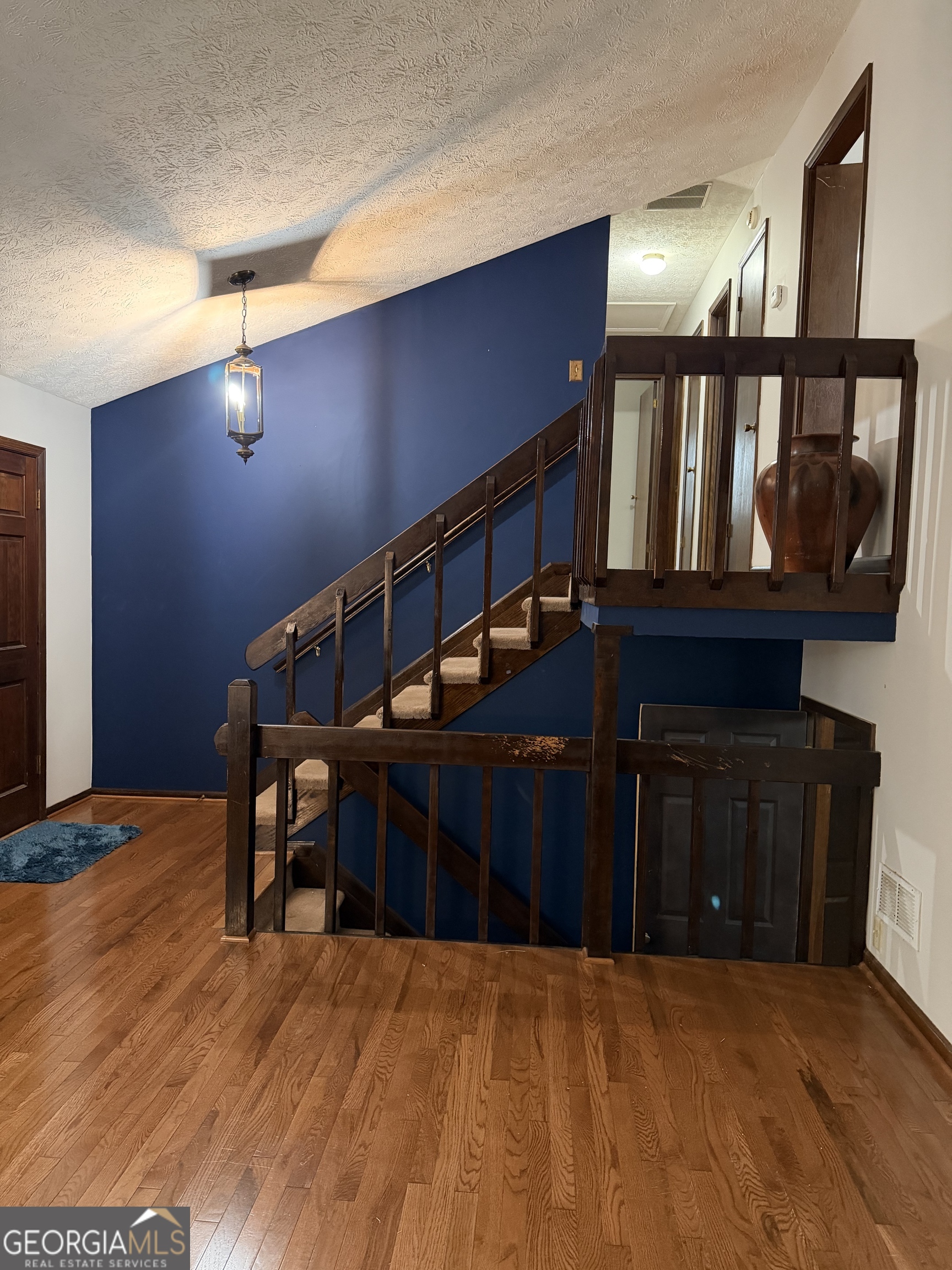 3403 Hidden Lane Rex, GA 30273 - Photo 4 of 27 a view of staircase with a fireplace and dining chair