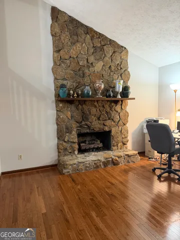 a view of a fireplace with wooden floor