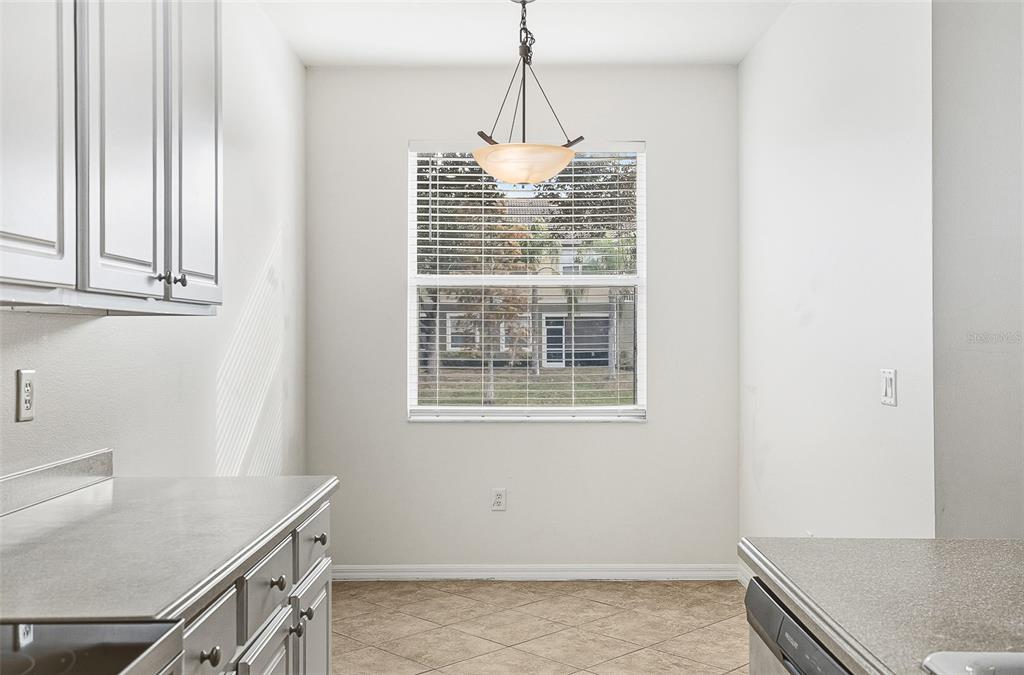 7928 Limestone Lane, Unit 19105 Sarasota, FL 34233 - Photo 18 of 37 a room with window and furniture