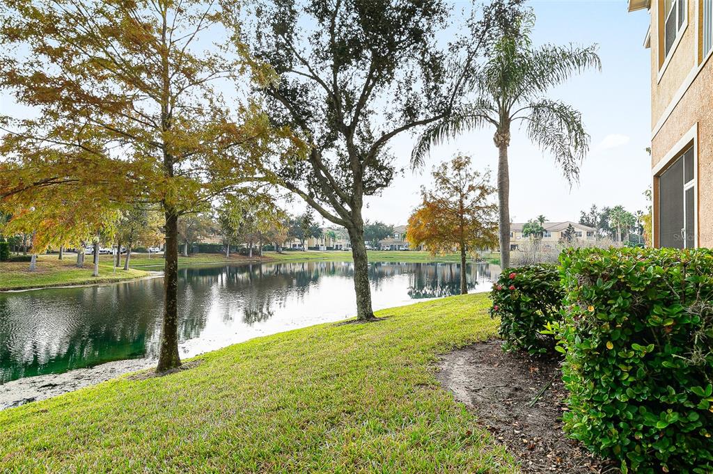 7928 Limestone Lane, Unit 19105 Sarasota, FL 34233 - Photo 22 of 37 a lake view with a yard