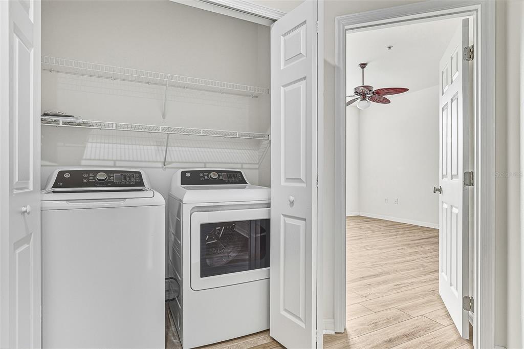 7928 Limestone Lane, Unit 19105 Sarasota, FL 34233 - Photo 24 of 37 a utility room with dryer and washer