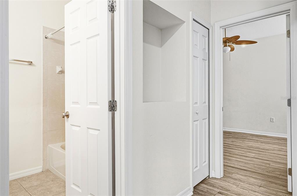 7928 Limestone Lane, Unit 19105 Sarasota, FL 34233 - Photo 30 of 37 a view of a bathroom from a hallway