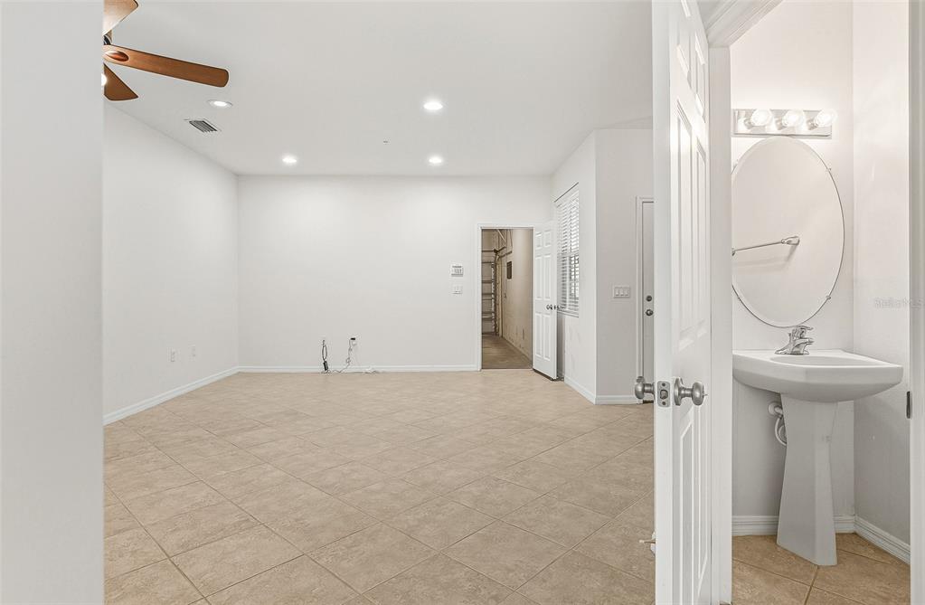 7928 Limestone Lane, Unit 19105 Sarasota, FL 34233 - Photo 8 of 37 a view of a livingroom with a fountain