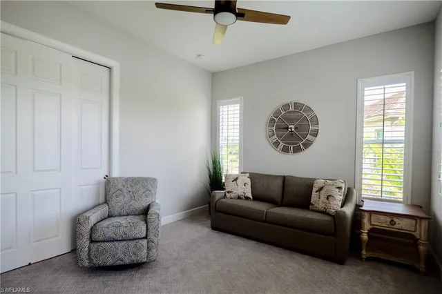 a living room with a couch and a window