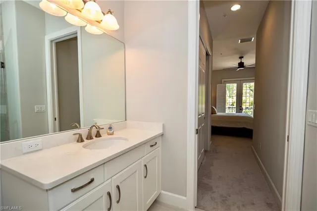 a en suite bathroom with a sink and a mirror