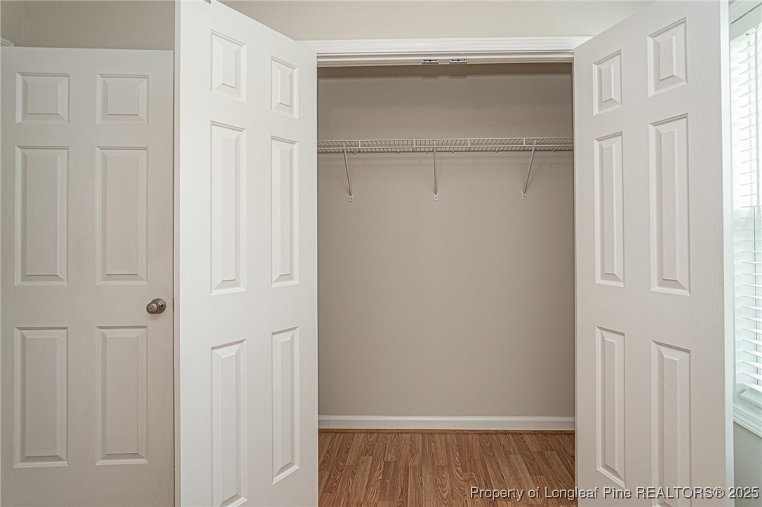 7650 Rufus Johnson Road Fayetteville, NC 28306 - Photo 29 of 43 a view of walk in closet with empty racks