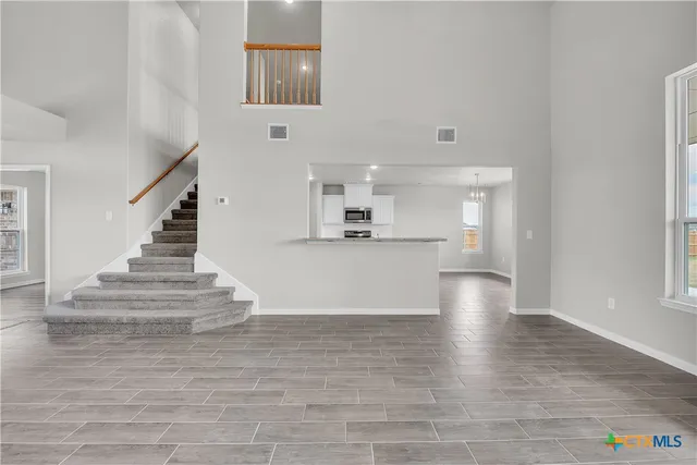 a view of kitchen with cabinets and wooden floor