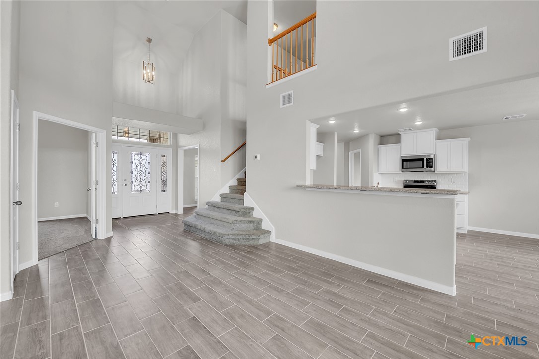 215 Overlook Trail Copperas Cove, TX 76522 - Photo 12 of 36 a view of kitchen with cabinets and wooden floor