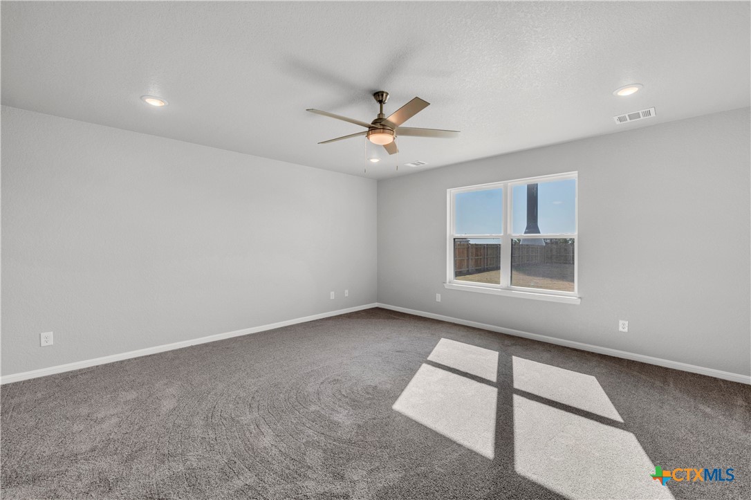 215 Overlook Trail Copperas Cove, TX 76522 - Photo 20 of 36 an empty room with windows and fan