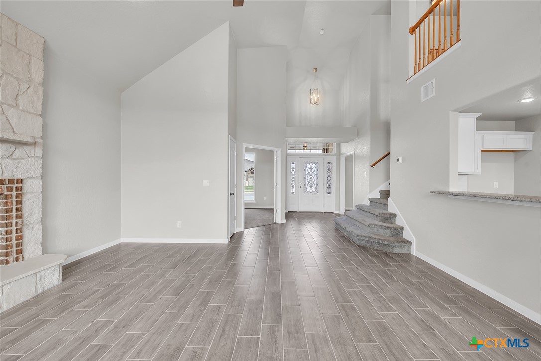 215 Overlook Trail Copperas Cove, TX 76522 - Photo 24 of 36 a view of a big room with wooden floor and windows