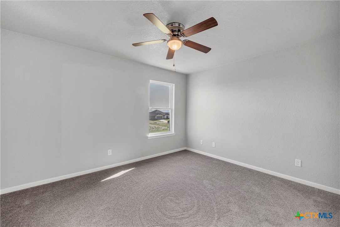 215 Overlook Trail Copperas Cove, TX 76522 - Photo 29 of 36 an empty room with ceiling fan and window