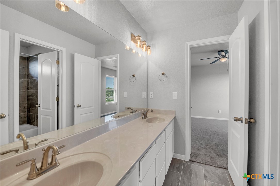 215 Overlook Trail Copperas Cove, TX 76522 - Photo 30 of 36 a bathroom with a double vanity sink mirror and double