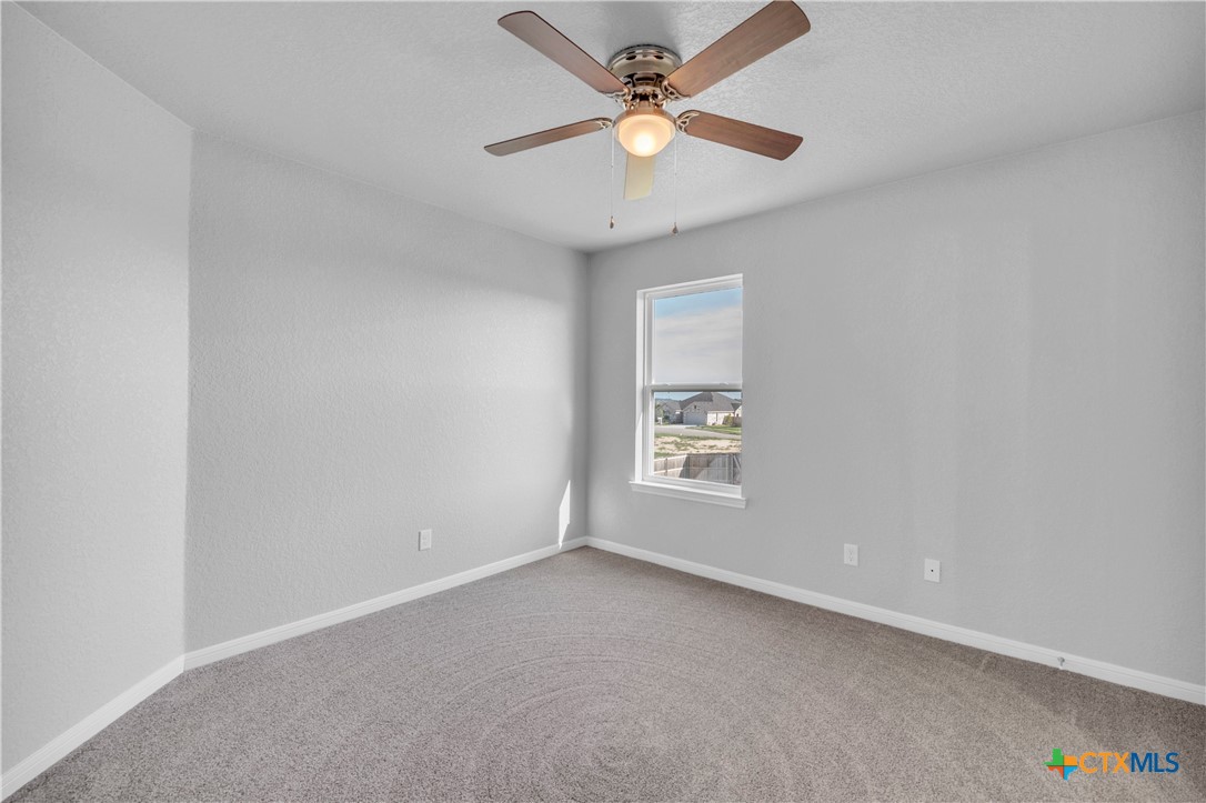 215 Overlook Trail Copperas Cove, TX 76522 - Photo 32 of 36 an empty room with a window and a fan