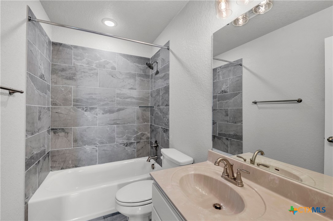 215 Overlook Trail Copperas Cove, TX 76522 - Photo 33 of 36 a bathroom with a sink toilet and shower